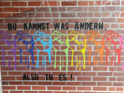 auf einer Wand steht: Du kannst was ändern, also tu es!
