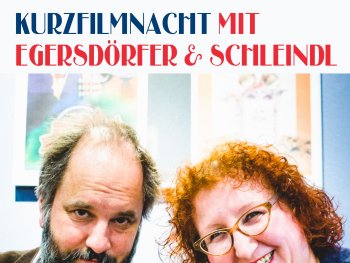 Copyright: Matthias Fetzer
Kurzfilmnacht mit Egersdörfer & Schleindl: Ein Mann mit grauem Bart und eine lächelnde Frau mit roten Locken und Brille blicken in die Kamera.