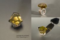 Ring mit großem facettiertem gelbem Citrin in silberner Fassung, gezeigt aus drei verschiedenen Blickwinkeln.