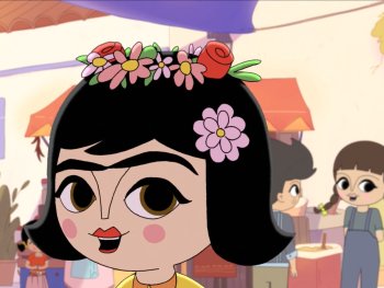 Copyright: eksystent Filmverleih, Tobo Media, Du Coup Studio Production, Maison 43
Animierte Figur mit schwarzem Haar, markanten Augenbrauen und Blumenschmuck im Haar spricht, im Hintergrund ein Marktplatz mit weiteren Kinderfiguren.