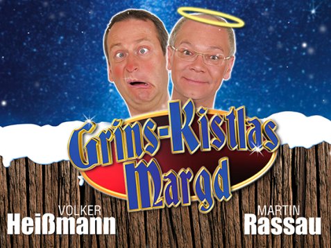 Volker Heißmann' und Martin Rassau vor sternenklarem Nachthimmel, einer mit Heiligenschein, darunter Schriftzug 'Grins-Kristlas Margd' auf Holzplanken, links 'Volker Heißmann', rechts 'Martin Rassau'
